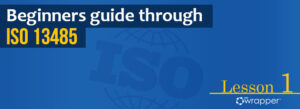 Blue header banner for "Beginners guide through ISO 13485" Lesson 1, featuring the qmsWrapper logo and a globe graphic representing international quality standards.